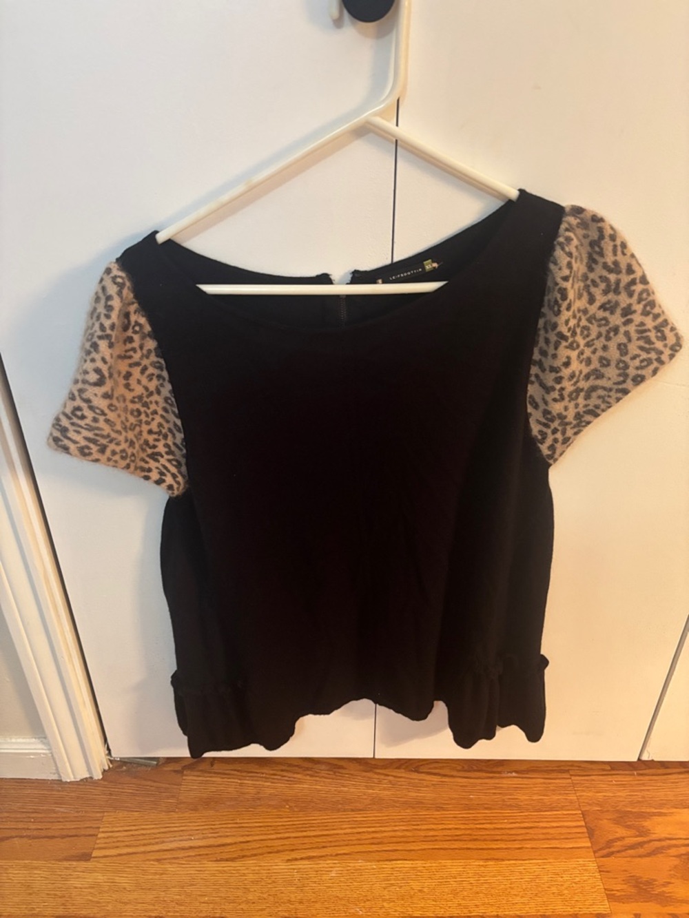 leifsdottir from Anthropologie Black Top with Leopard Print Sleeves